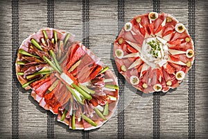 Traditional Appetizer Savory Welcome Dishes Served on Rustic Crinkly Interlaced Paper Parchment Place Mat Vignette Background