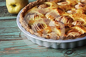 Traditional apple pie, fruit dessert, tart with fresh apples on wooden rustic table