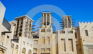 Traditional Arab wind tower for air conditioning and cooling on top of building in Dubai