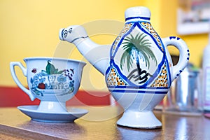 Traditional Arabic cappuccino jug in the shape of a camel, dromadaire. photo