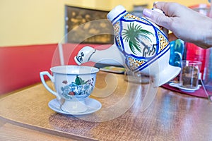 Traditional Arabic cappuccino jug in the shape of a camel, dromadaire. photo