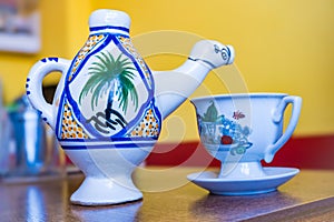 Traditional Arabic cappuccino jug in the shape of a camel, dromadaire. photo