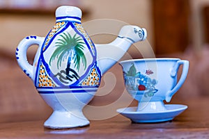 Traditional Arabic cappuccino jug in the shape of a camel, dromadaire. photo