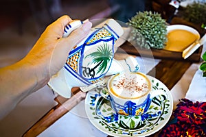 Traditional Arabic cappuccino jug in the shape of a camel, dromadaire. photo