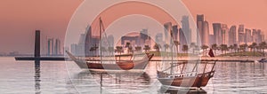 Traditional Arabic Dhow boats in Doha harbour, Qatar photo