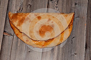 Traditional Arabic Syrian cuisine of a baked snack called Manakish a middle eastern bread similar to pizza stuffed with chicken