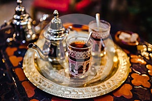 Traditional Arabic tea cup, arab people drinking tea in Ramadan