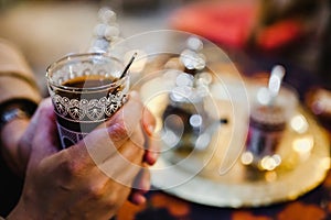 Traditional Arabic tea cup, arab people drinking tea in Ramadan