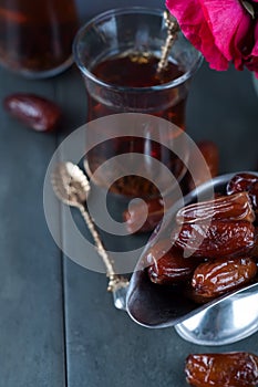 Traditional arabic tea and dry dates.