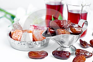 Traditional arabic tea set and dried dates.