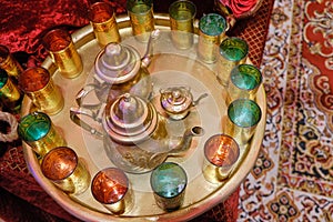 Traditional arabic tea set and dried dates.Top view.