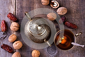Traditional arabic tea set and dried dates.