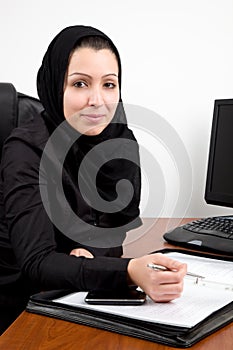 Traditional Arabic young woman at the office