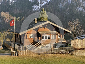 Traditional architecture and farmhouses in the alpine valley of KlÃ¶ntal or Kloental and by the resevoir lake KlÃ¶ntalersee