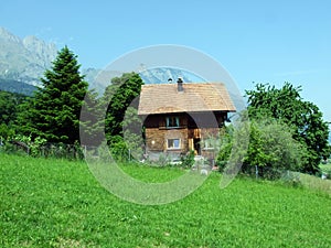 Traditional architecture and farmhouses on the slopes of the Alpstein massif and in the Rhine valley Rheintal, Gams