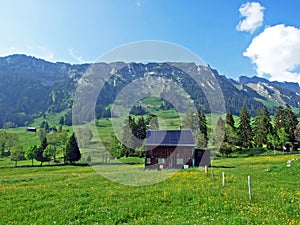 Traditional architecture and farmhouses on the slopes of the Alpstein massif and in the Rhine valley Rheintal, Gams