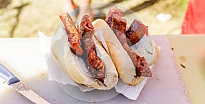 Traditional argentina choripan sandwich with pork sausages