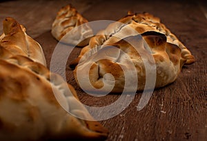 Traditional Argentinean empanadas pie on table, meat Chicken and vegetables