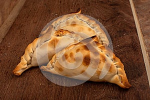 Traditional Argentinean empanadas pie on table, meat Chicken and vegetables