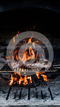 Traditional asado grilling in an ancient, rustic fireplace photo