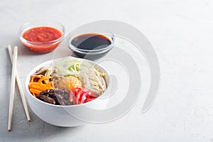 Traditional Asian Bibimbap dish with rice and vegetables