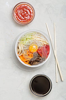 Traditional Asian Bibimbap dish with rice and vegetables