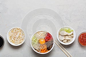 Traditional Asian Bibimbap dish with rice and vegetables