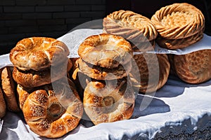 traditional Asian bread Uzbek tandoor flatbread on counter at bazaar in Uzbekistan