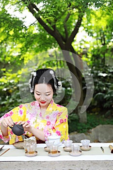 Traditional Asian Japanese beautiful woman conduct tea ceremony