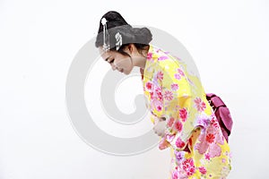 Traditional Asian Japanese woman with kimono respectful bow on isolated white background