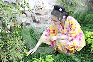 Traditional Asian Japanese woman in a outdoor garden