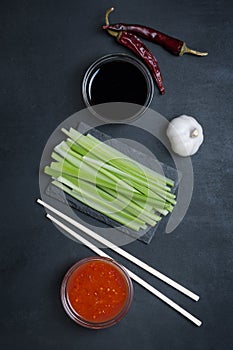 Traditional Asian stir fry chicken wings with sesame and vegetables