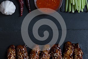 Traditional Asian stir fry wings with sesame and vegetables