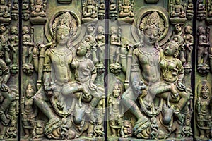 Traditional Asian stone carving of Buddhism deities illustrating Asian culture and Asian carving craft