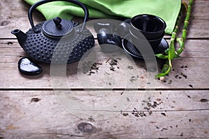 Traditional asian tea set on aged wooden background