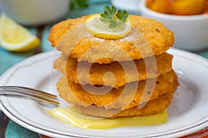 A traditional Austrian Wiener Schnitzel served with fresh ingredients, capturing the essence of Austrian cuisine