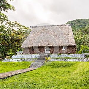 Traditional authentic fijian Bure, wood-and-straw thatched walls, roof hut. Levuka town, Ovalau island, Fiji, Melanesia, Oceania.