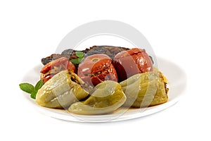 Traditional Azerbaijan food Dolma. Uc baci, Pomidor badimcan biber dolmasi. Tomatoes, eggplants and peppers filled with meat photo