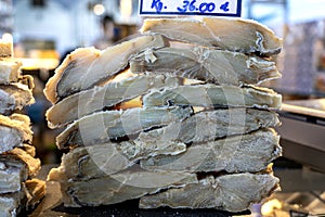 traditional bacalhau salted codfish hanging in a market in Porto Portugal