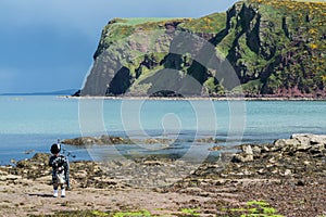 Traditional bagpiper in full dress code near Pennan