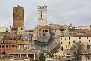 Traditional baix emporda village of Cruilles. Tower and church. Spain