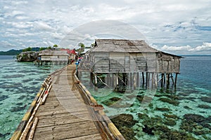 Traditional bajo village with bridge and wooden houses on the Togean islands in Central Sulawesi, Indonesia