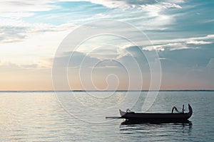 Traditional Bali Fishing Boat Without Passenger Floating On A Very Calm and Peaceful Ocean