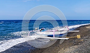 Jukung, the traditional Balinese fishing boat, at the beach in Amed. Bali, Indonesia photo
