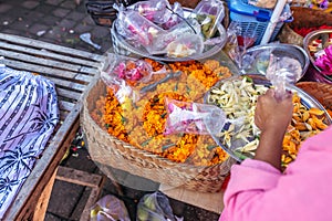 Traditional balinese handmade offering to gods on a morning market in Ubud. Bali island.