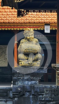 A traditional balinese hindu statue at an ancient temple in Indonesia