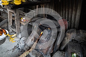 The traditional Balinese kitchen is complete with a wood-fired clay stove. The stove is black because it was burnt by the fire.