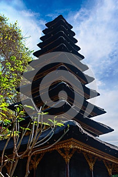 Traditional Balinese many tier palm roof in the temple