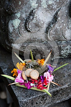 Traditional balinese offering to gods with flowers