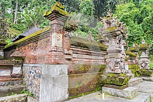 Traditional Balinese temple in a forest at a side of rice terrace plantation, Ubud Bali